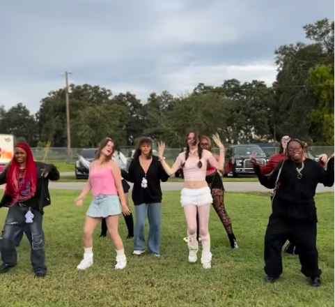 A group of people posing for a photo

AI-generated content may be incorrect.